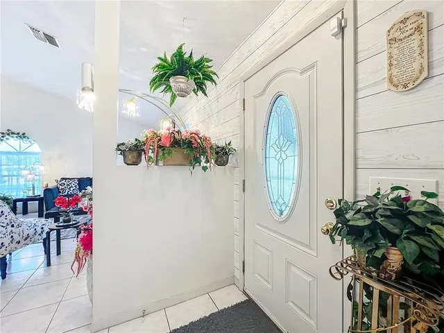 an aerial view of residential houses with outdoor space and swimming pool