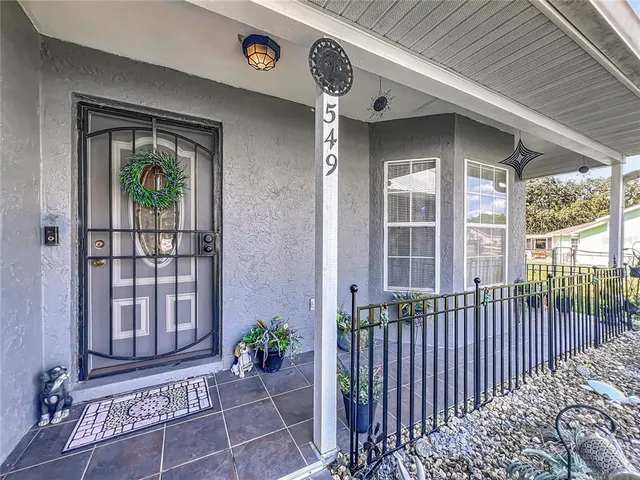 an aerial view of multiple houses with yard