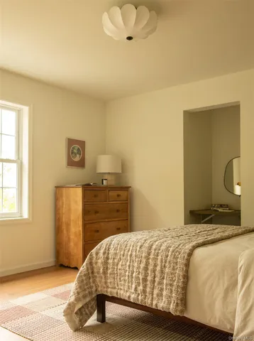 a bedroom with a bed and dresser