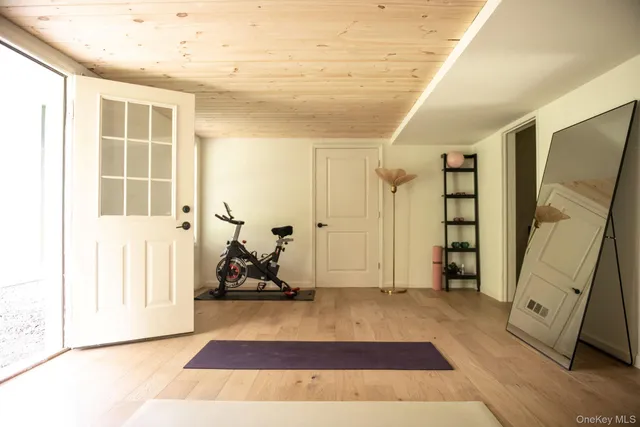 a view of an entryway with wooden floor