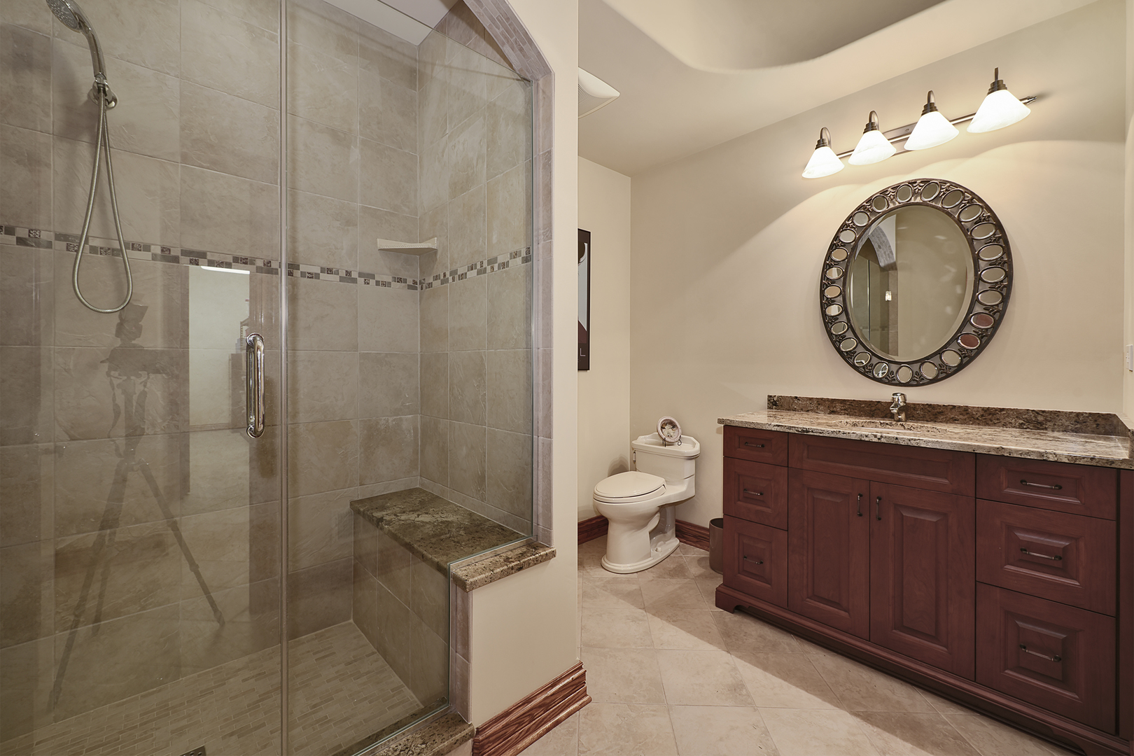 10 Carnoustie Lane Inverness, IL 60067 - Photo 33 of 44 a bathroom with a granite countertop sink mirror vanity and toilet