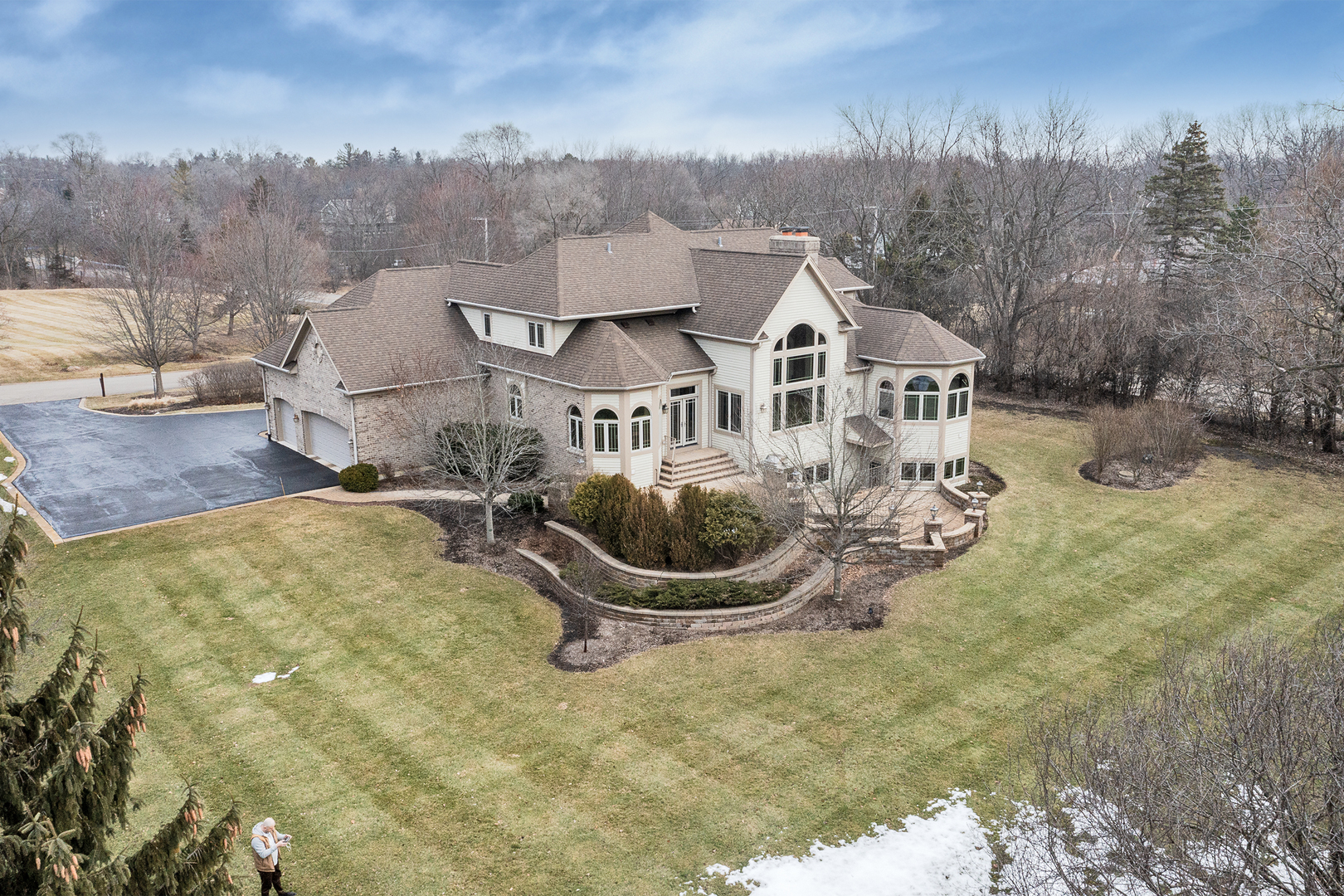 10 Carnoustie Lane Inverness, IL 60067 - Photo 44 of 44 a front view of a house with yard slide and large trees