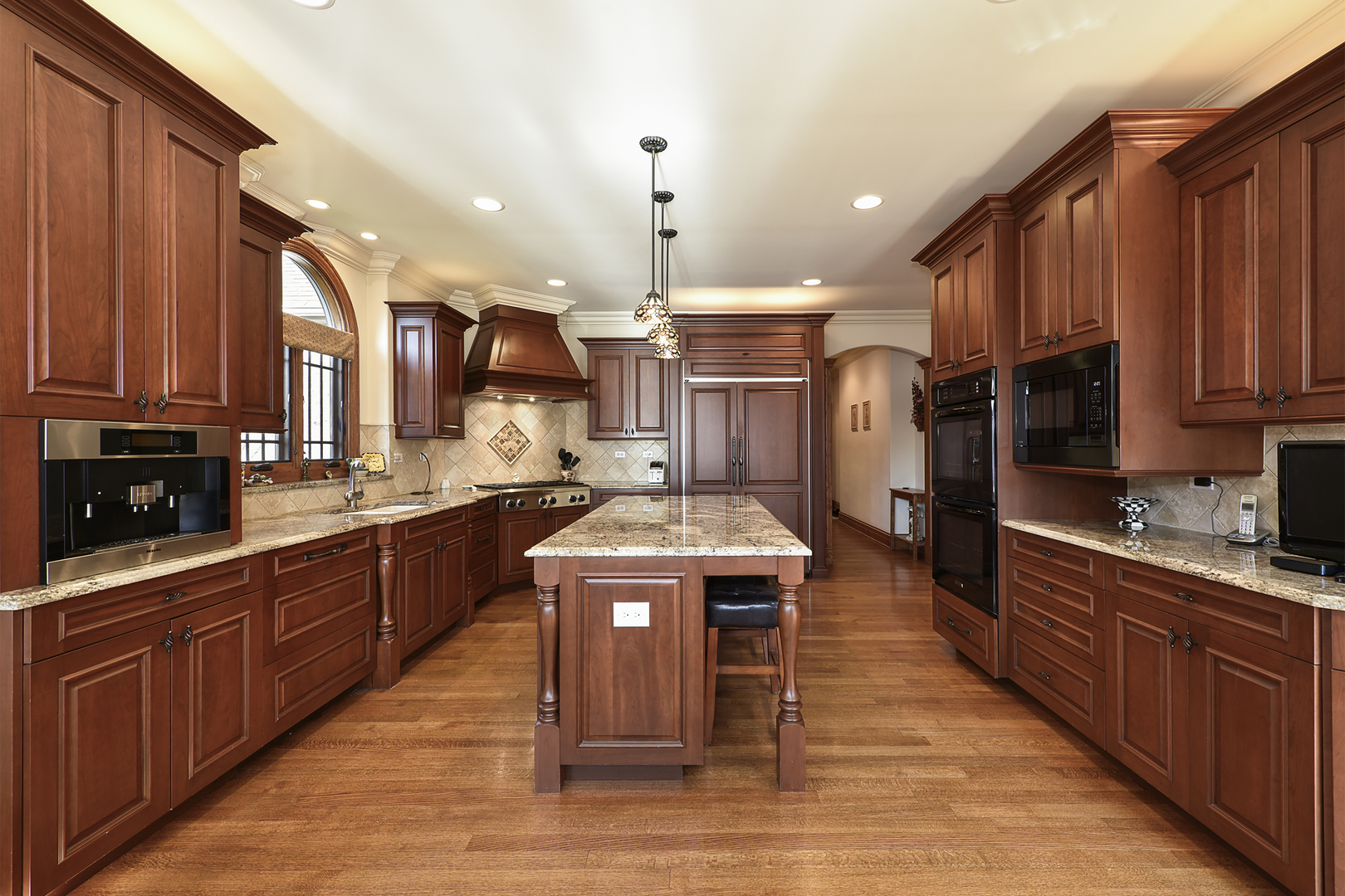 10 Carnoustie Lane Inverness, IL 60067 - Photo 6 of 44 a kitchen with stainless steel appliances granite countertop wooden cabinets a sink dishwasher a stove and a refrigerator