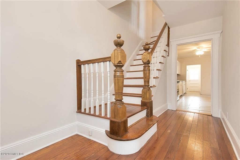 25 Valley Road, Unit 25 Cos Cob, CT 06807 - Photo 3 of 17 a view of entryway and hall with wooden floor