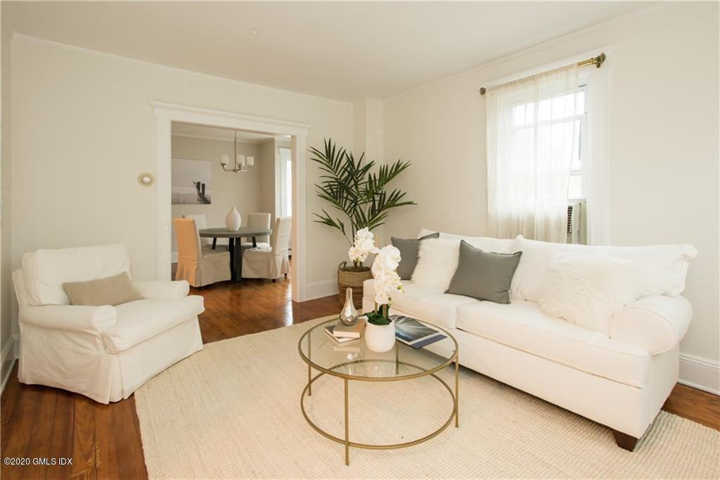 25 Valley Road, Unit 25 Cos Cob, CT 06807 - Photo 4 of 17 a living room with furniture a table and a potted plant