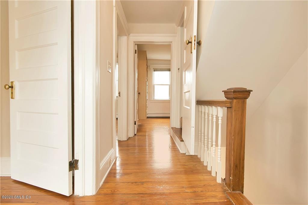 25 Valley Road, Unit 25 Cos Cob, CT 06807 - Photo 7 of 17 a view of a hallway with wooden floor