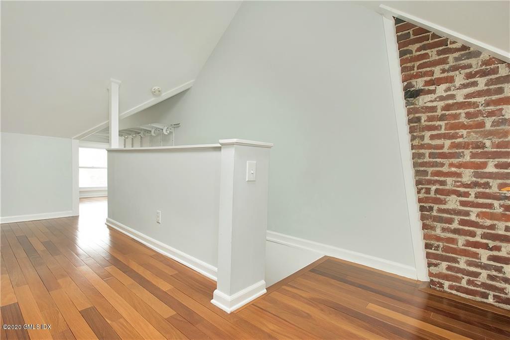 25 Valley Road, Unit 25 Cos Cob, CT 06807 - Photo 9 of 17 a view of an empty room with wooden floor
