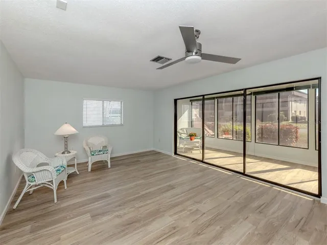 a view of an empty room with glass door