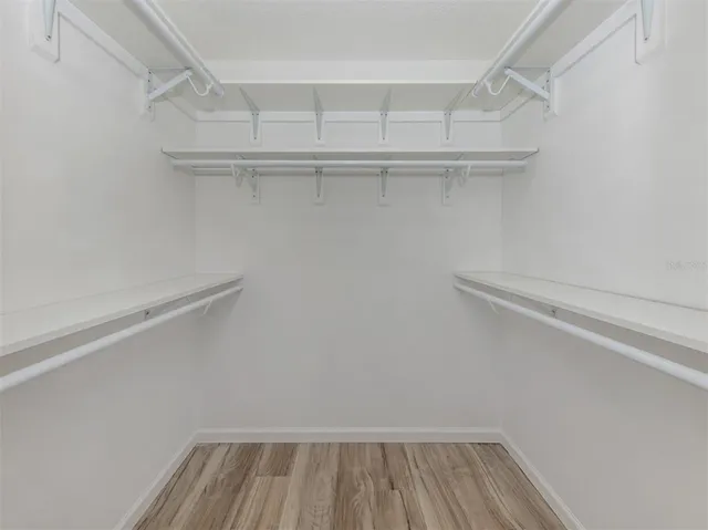 a view of an empty walk in closet