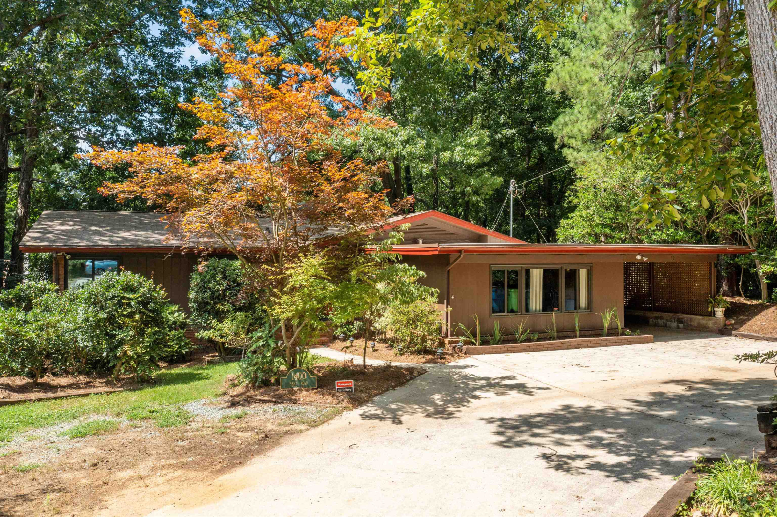 Lots of flowers, trees, camellias and azaleas surround this beautiful home. Large yard with steps going up towards the street give lots of room for recreation and relaxing. Exterior Front