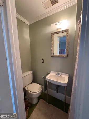 an empty room with window and wooden floor