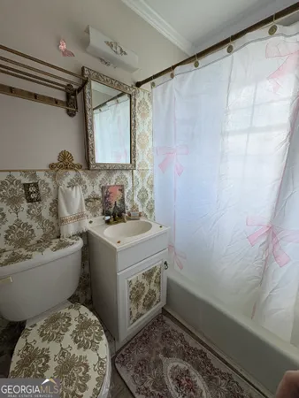 a kitchen with stainless steel appliances granite countertop a sink a stove a refrigerator a microwave and cabinets