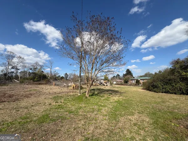 a view of a backyard of the house
