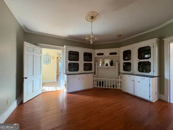 a large kitchen with stainless steel appliances granite countertop a stove a sink dishwasher and a refrigerator