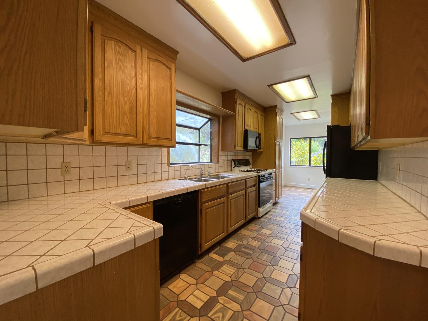 220 Minerva Avenue Pacifica, CA 94044 - Photo 5 of 22 a kitchen with a sink and cabinets