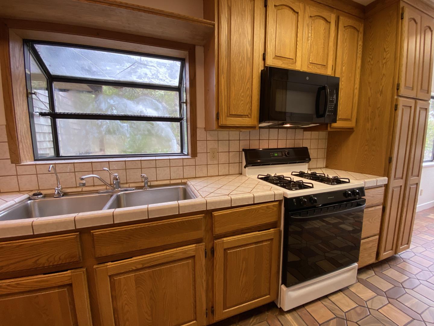 220 Minerva Avenue Pacifica, CA 94044 - Photo 6 of 22 a view of a sink and a microwave