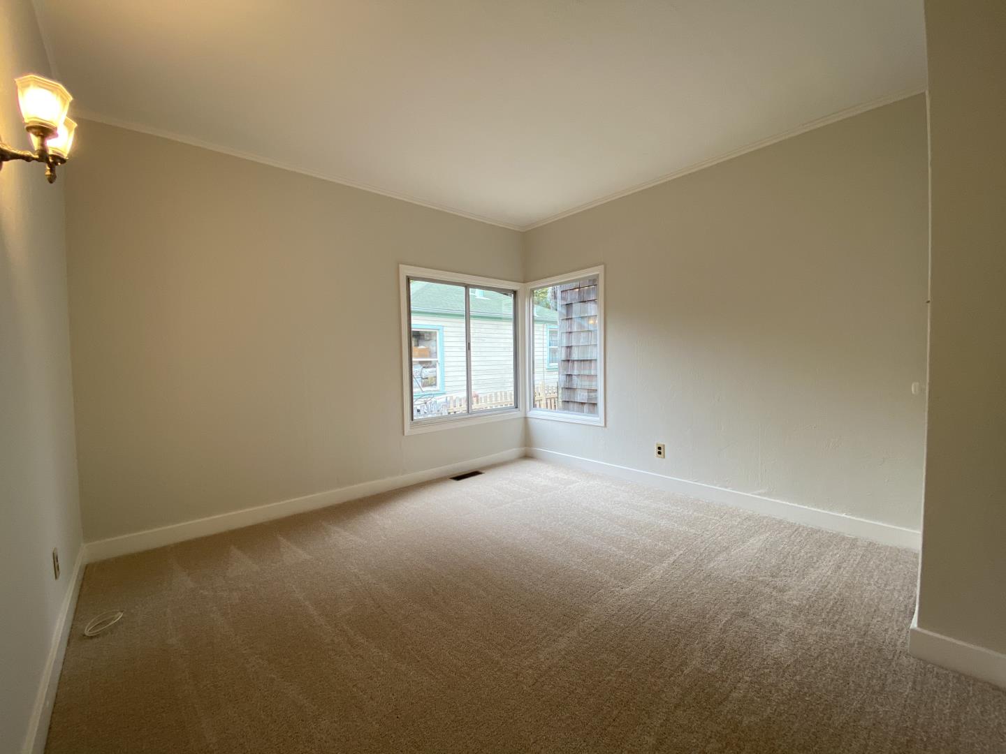 220 Minerva Avenue Pacifica, CA 94044 - Photo 7 of 22 an empty room with windows