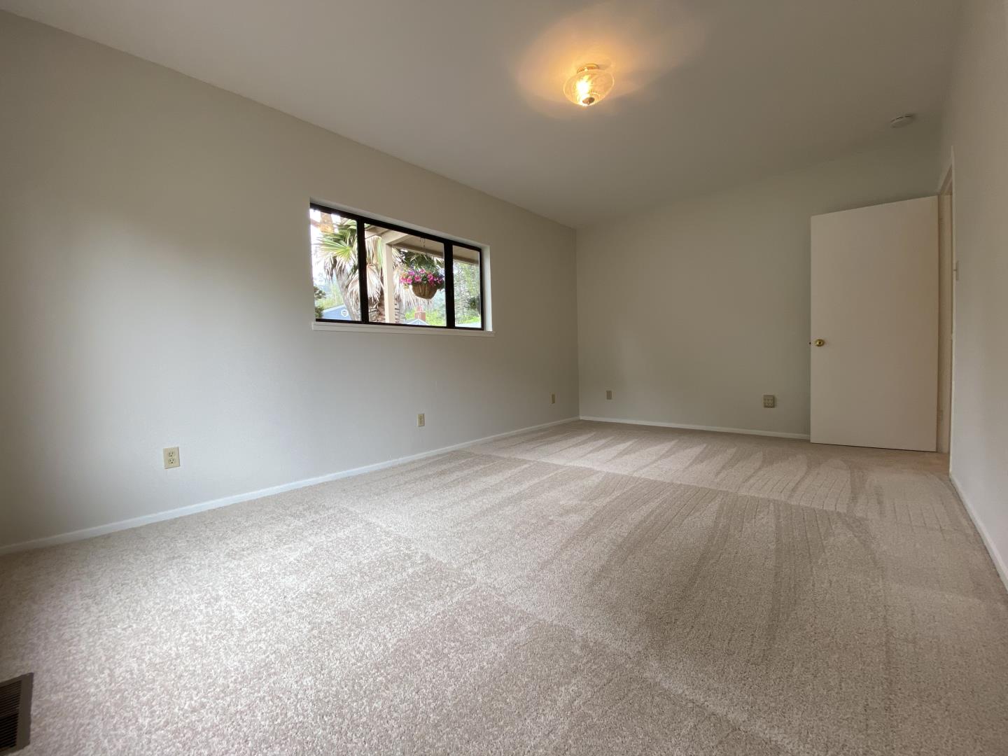 220 Minerva Avenue Pacifica, CA 94044 - Photo 10 of 22 a view of an empty room with a window