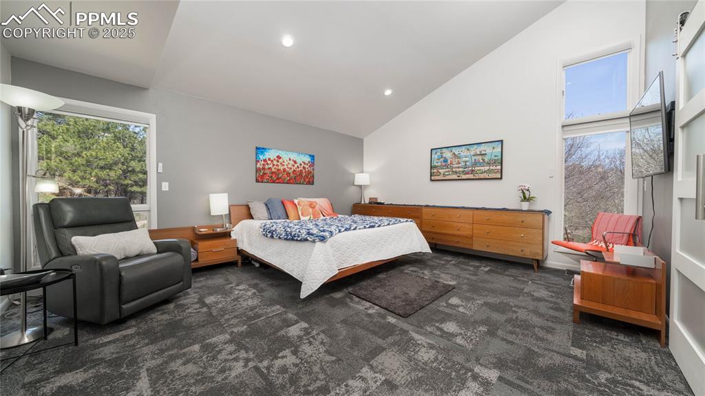 7550 Dairy Ranch Road Colorado Springs, CO 80919 - Photo 14 of 39 a bedroom with bed and a couch