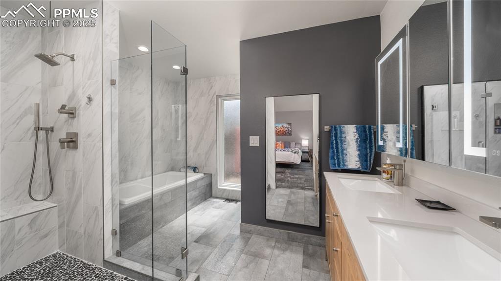 7550 Dairy Ranch Road Colorado Springs, CO 80919 - Photo 16 of 39 a bathroom with a sink a toilet and shower