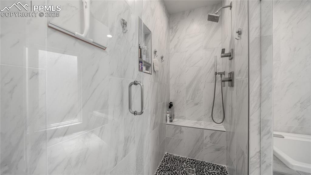 7550 Dairy Ranch Road Colorado Springs, CO 80919 - Photo 18 of 39 a bathroom with a shower