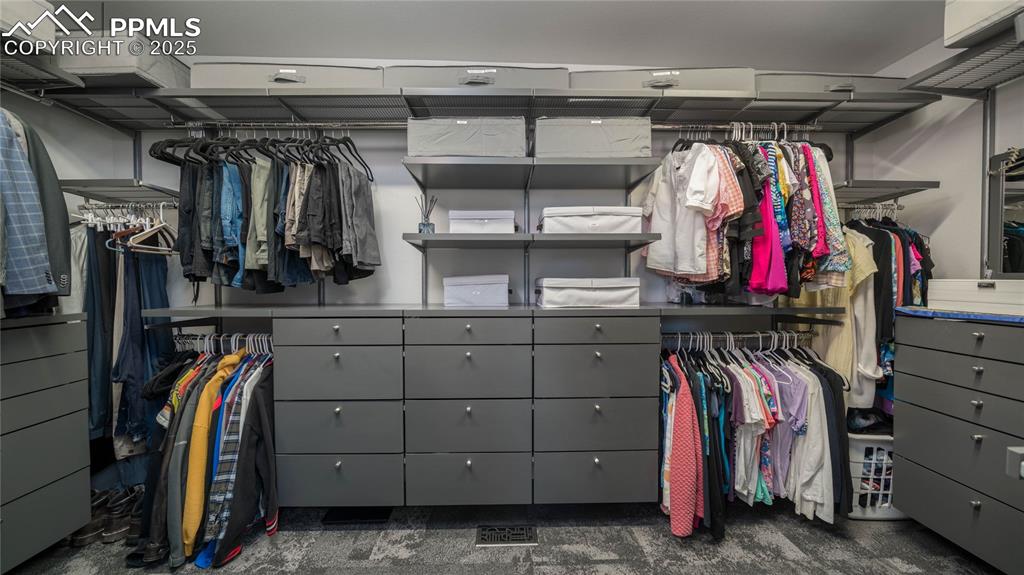 7550 Dairy Ranch Road Colorado Springs, CO 80919 - Photo 19 of 39 a view of walk in closet with clothes and shoes