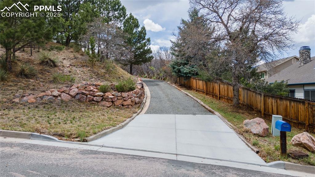 7550 Dairy Ranch Road Colorado Springs, CO 80919 - Photo 3 of 39 a view of a backyard with wooden fence