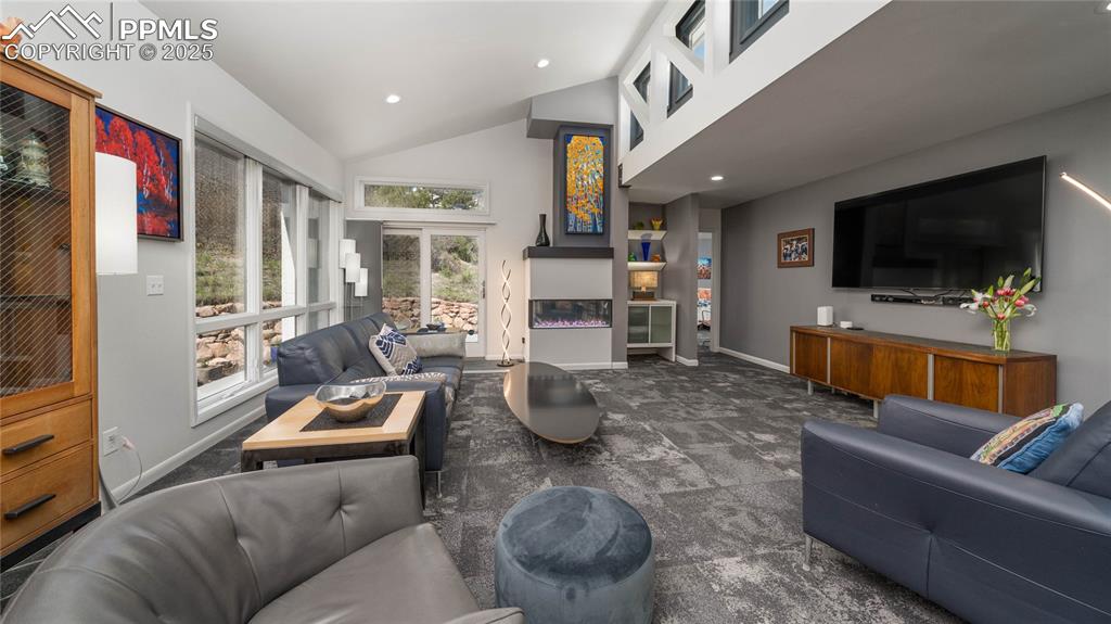 7550 Dairy Ranch Road Colorado Springs, CO 80919 - Photo 7 of 39 a living room with furniture and a flat screen tv
