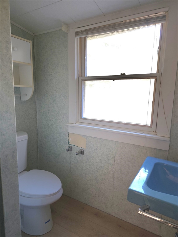 3 Jacobson Drive, Unit 2 Auburn, MA 01501 - Photo 13 of 20 a bathroom with a toilet a sink and a window