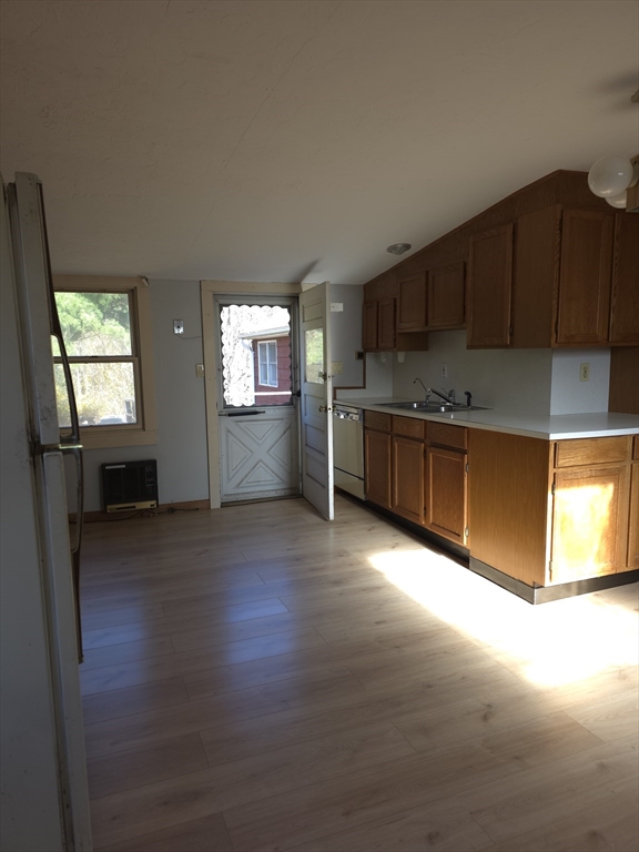 3 Jacobson Drive, Unit 2 Auburn, MA 01501 - Photo 16 of 20 a kitchen with stainless steel appliances granite countertop a stove a sink and a refrigerator