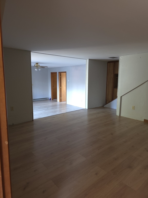 3 Jacobson Drive, Unit 2 Auburn, MA 01501 - Photo 18 of 20 an empty room with a empty space and window