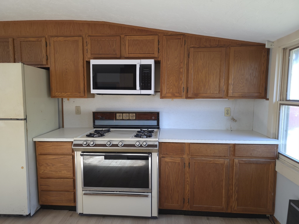3 Jacobson Drive, Unit 2 Auburn, MA 01501 - Photo 20 of 20 a kitchen with a stove and a microwave