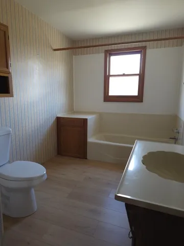 a bathroom with a toilet and a sink