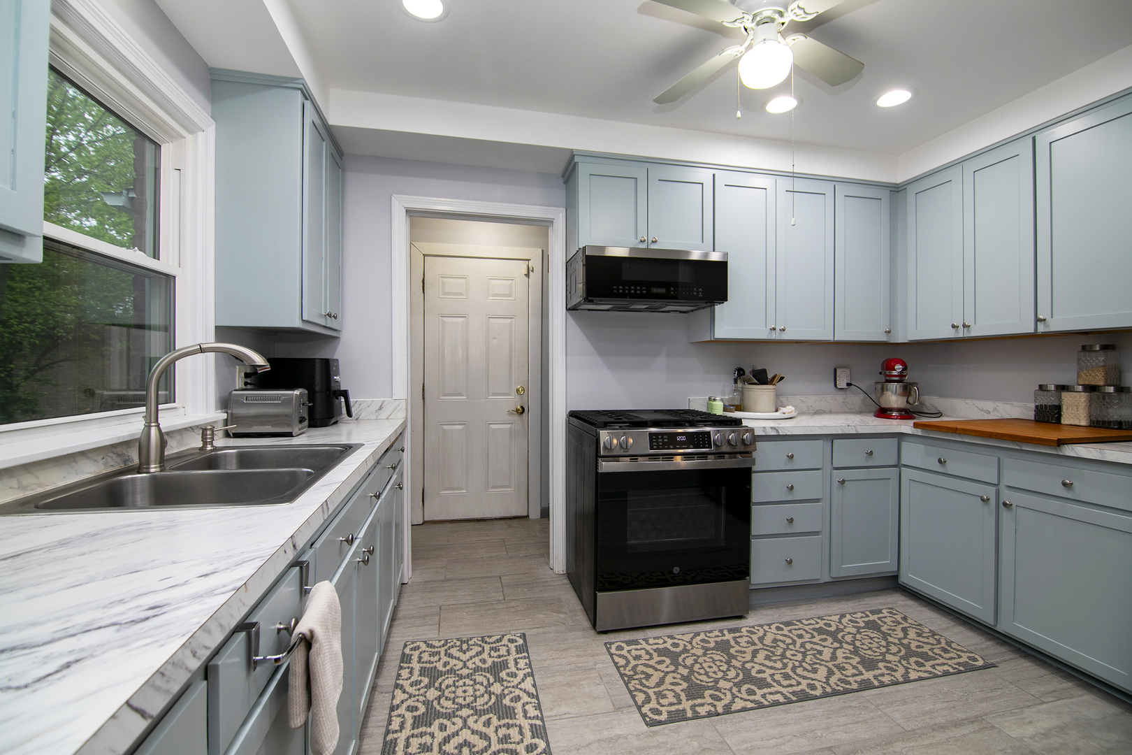2444 183rd Street Homewood, IL 60430 - Photo 10 of 25 a kitchen with a stove sink and cabinets