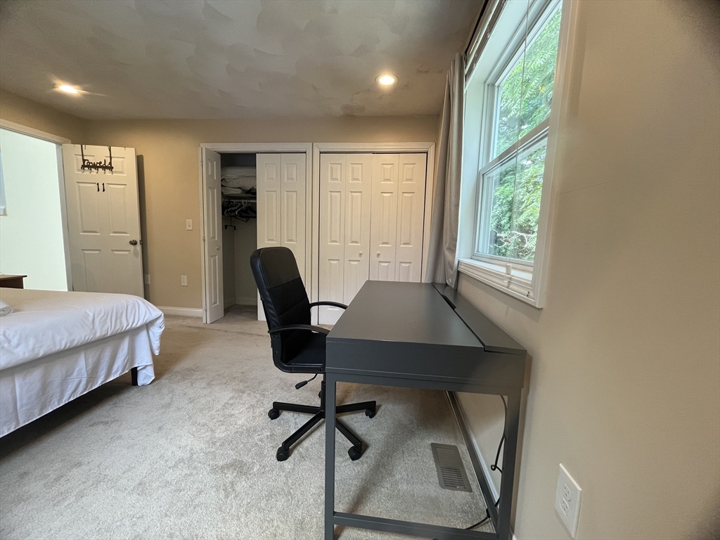 195 Grove Street, Unit 201 Cambridge, MA 02138 - Photo 12 of 20 a workspace with furniture and a window