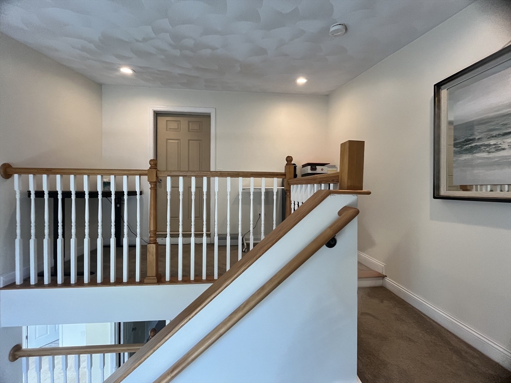 195 Grove Street, Unit 201 Cambridge, MA 02138 - Photo 14 of 20 a view of hallway with stairs