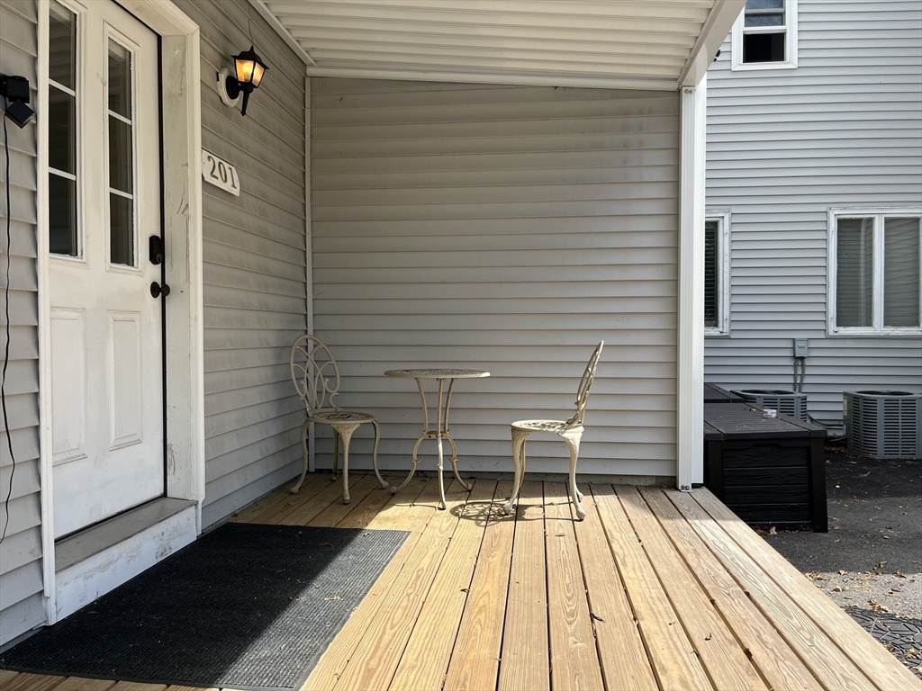 195 Grove Street, Unit 201 Cambridge, MA 02138 - Photo 19 of 20 a balcony with view of a patio
