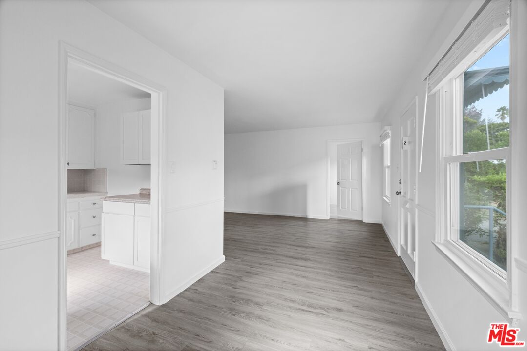 3493 Meier Street Los Angeles, CA 90066 - Photo 11 of 31 a view of a hallway with wooden floor