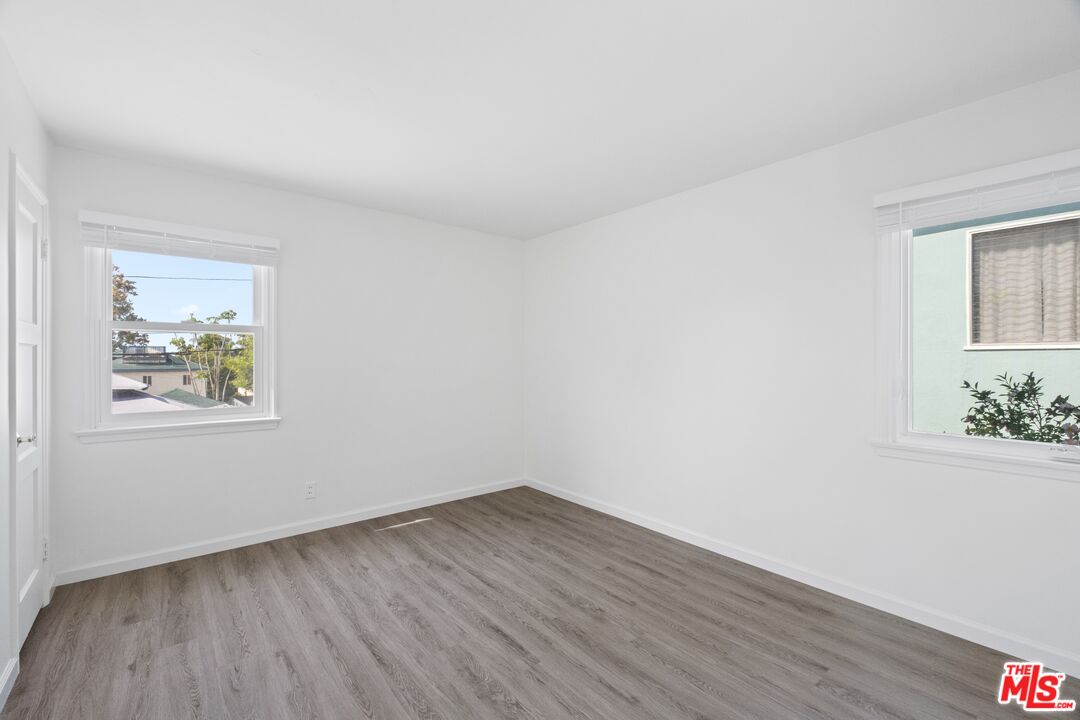 3493 Meier Street Los Angeles, CA 90066 - Photo 13 of 31 a view of an empty room with wooden floor and a window