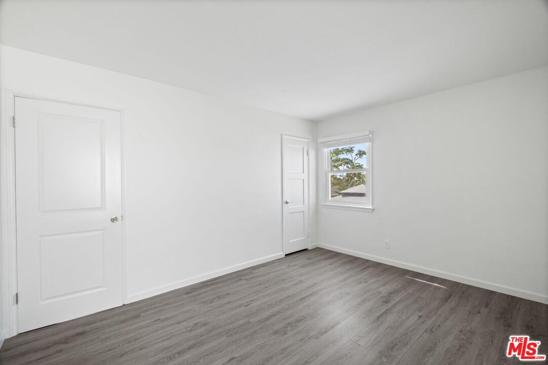 3493 Meier Street Los Angeles, CA 90066 - Photo 14 of 31 an empty room with wooden floor and windows
