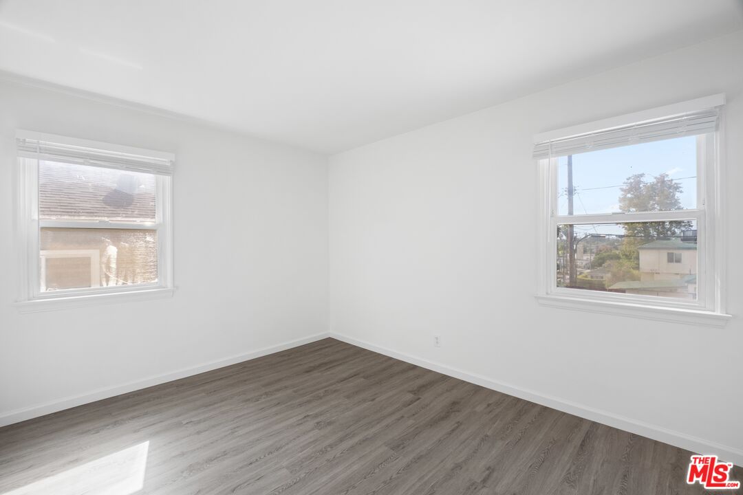3493 Meier Street Los Angeles, CA 90066 - Photo 16 of 31 a view of an empty room with wooden floor and a window
