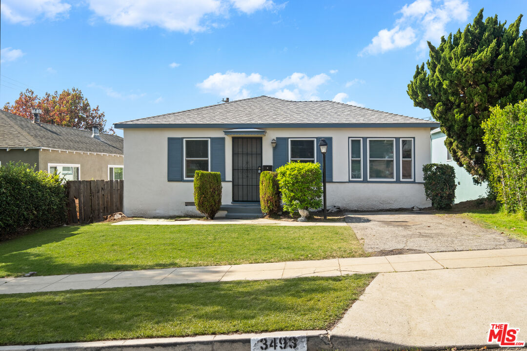 3493 Meier Street Los Angeles, CA 90066 - Photo 2 of 31 a view of a house with a yard and potted plants