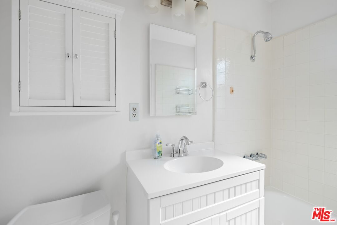 3493 Meier Street Los Angeles, CA 90066 - Photo 22 of 31 a bathroom with a sink toilet and vanity