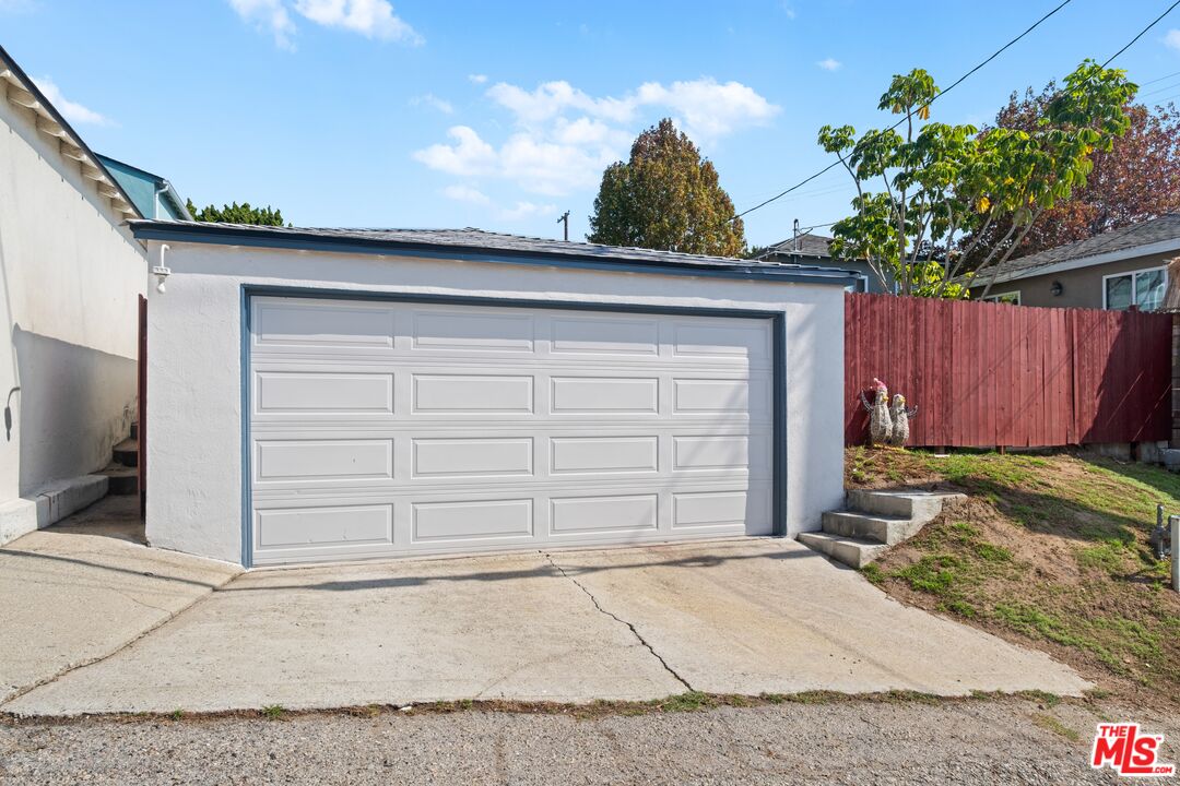 3493 Meier Street Los Angeles, CA 90066 - Photo 29 of 31 a front view of a house with a yard and garage