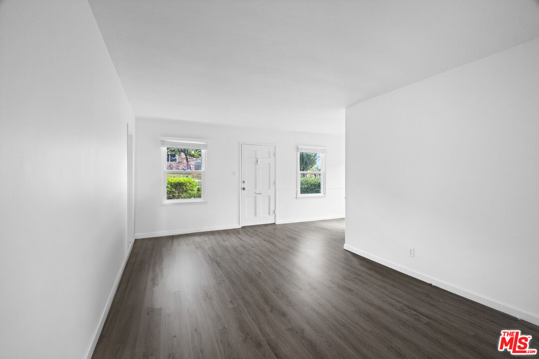3493 Meier Street Los Angeles, CA 90066 - Photo 8 of 31 an empty room with wooden floor and windows