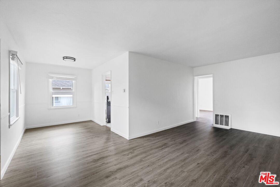 3493 Meier Street Los Angeles, CA 90066 - Photo 9 of 31 an empty room with wooden floor and windows