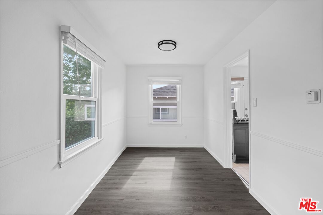 3493 Meier Street Los Angeles, CA 90066 - Photo 10 of 31 a view of an empty room with wooden floor and a window