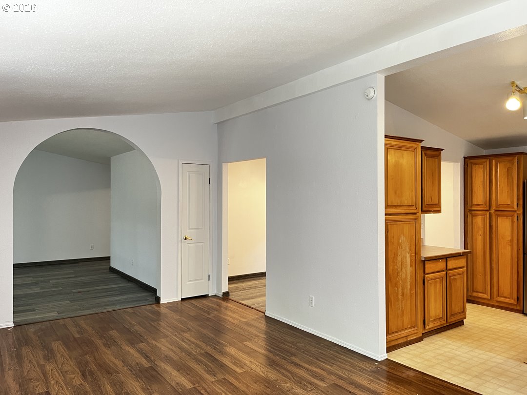 83411 Clear Lake Road Florence, OR 97439 - Photo 10 of 47 wooden floor in an empty room with a window