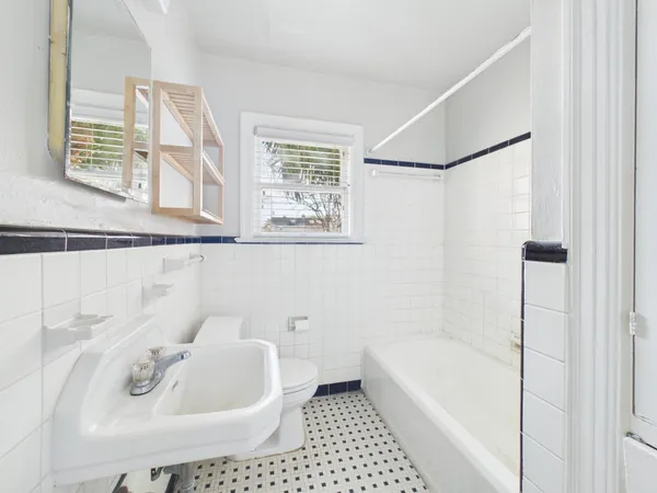 a view of hallway with wooden floor