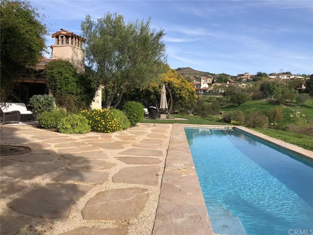 a view of swimming pool with a yard